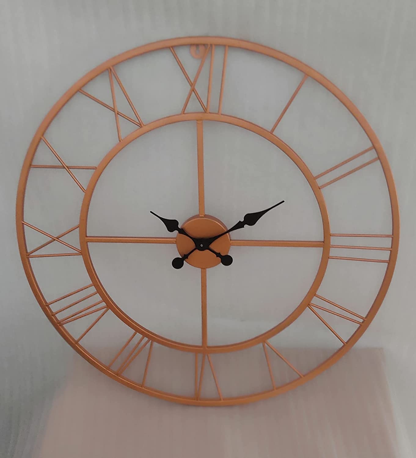 Metal Wall Clock by Hansart Total Wall Coverage Area: 24 x 24 Inches Made of Premium-Quality Iron Metal Anti-rust powder coating used Hanging Mechanism included Perfect for your living room, bedroom, hall, office reception, guest room, and hotel reception The product is packed by professionals for safe delivery  Designed to make your home look complete "Hansart Made In India because India itself is an art".